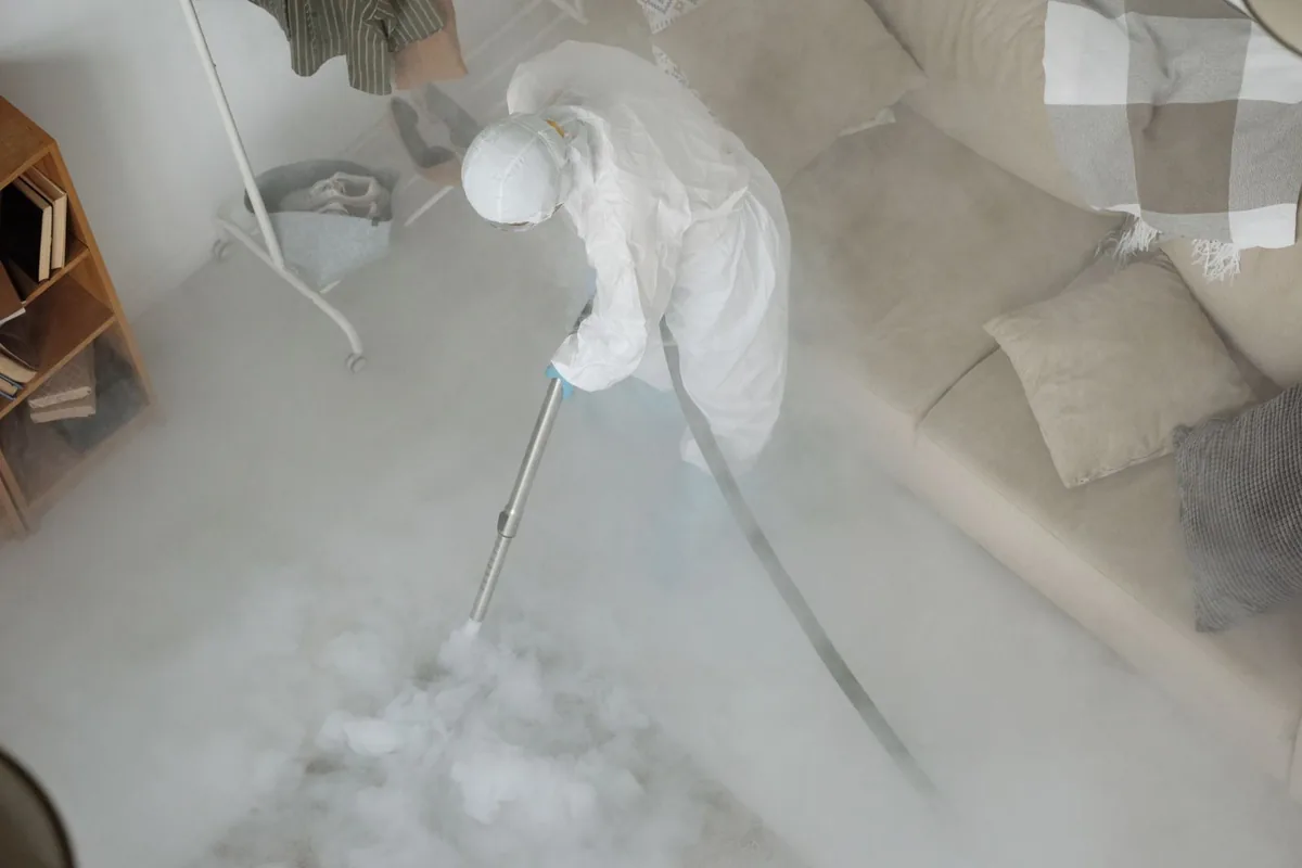 Biohazard cleanup technician in protective equipment, Downey, CA